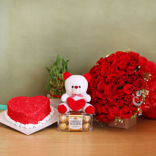 Gift Hamper of 50 Red Roses Bunch + 16 Pc Ferrero Rocher + 6 Inch Teddy +  Bamboo Half  Kg Heart Shape Red Valvet Cake