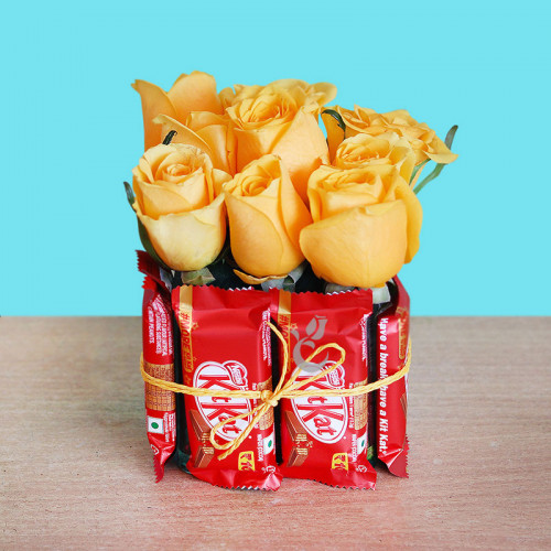 9 yellow roses arrangement with square vase wth 8 kitkat