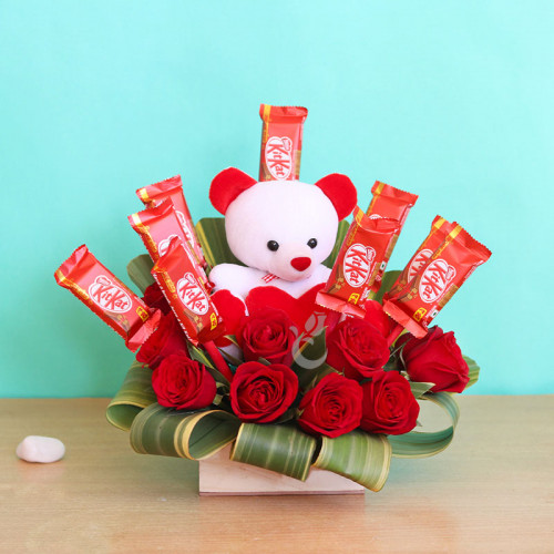 Combo of 10 kitkat+10 red roses+1 teddy in a box arrangement