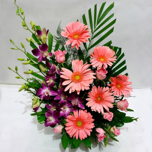 6 Orchids+6 pink Roses+3 Pink Geraberas in a basket arrangement
