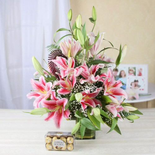 10 Pink Lilies in vase arrangement + Ferrero rocher