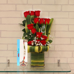 Wow Rakhi combo of 12 red roses in vase + One Rakhi