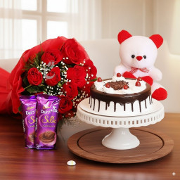 Pampering Surprise: A Gift Combo of 10 red roses, 2 Cadbury Dairy Milk Silk, 0.5 Kg Black Forest cake and 6 inch teddy bear Pampering Surprise: A Gift Combo of 10 red roses, 2 Cadbury Dairy Milk Silk, 0.5 Kg Black Forest cake and 6 inch teddy bear