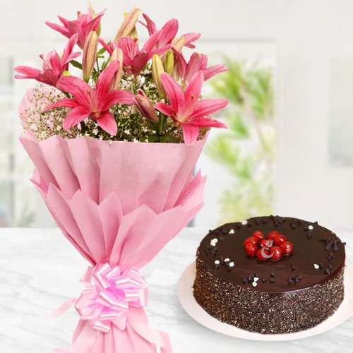 6 Pink Lilies in Pink Paper Packing & Half Kg Chocolate Cake