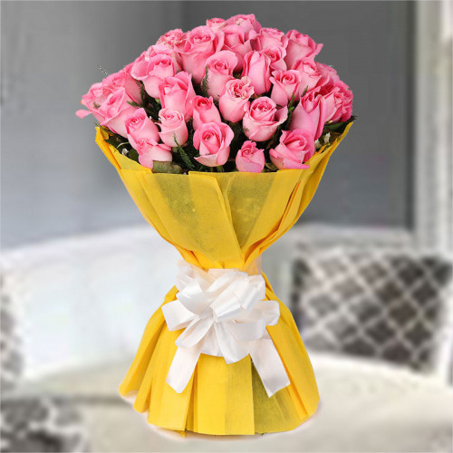 50 Pink Roses in Yellow Paper Packing