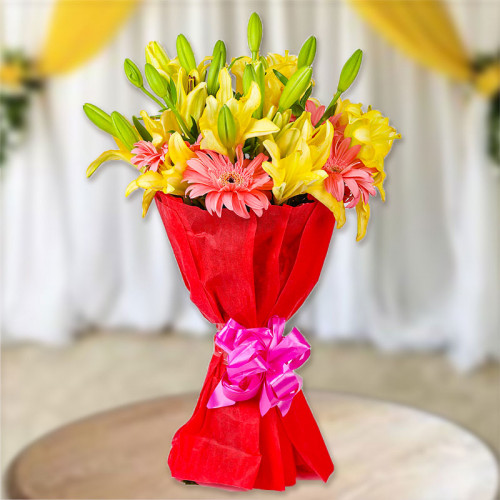 8 Yellow Lilies, 6 Pink Gerberas with Red paper packing