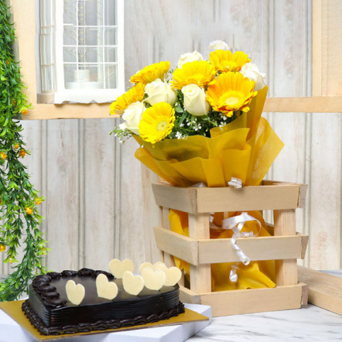 Bunch of White Roses & Yellow Gerbera in Yellow Paper Half Kg Heart Shaped Chocolate Cake - Front View