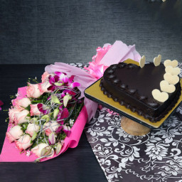 Floral Indulgence: A Gift Combo of 10 Pink Roses and 3 Purple Orchids and 0.5 Kg Heart-Shaped Chocolate Cake Floral Indulgence: A Gift Combo of 10 Pink Roses and 3 Purple Orchids and 0.5 Kg Heart-Shaped Chocolate Cake