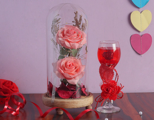 Warm wishes combo of 1 rose candle and 1rose in a glass dome’s