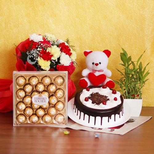 Combo Gift of 12 Mix Carnation + Half kg Black Forest Cake + Bamboo + Teddy + 24 Ferrero Rocher