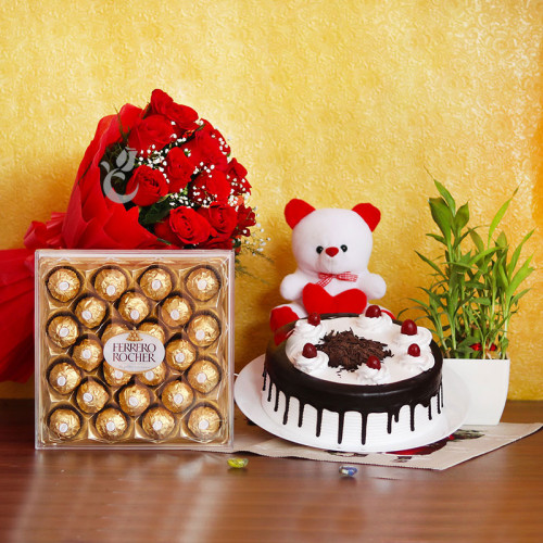 Combo Gift of 12 Red Roses + Half kg Black Forest Cake + 24 Ferrero Rocher + Bamboo + Teddy