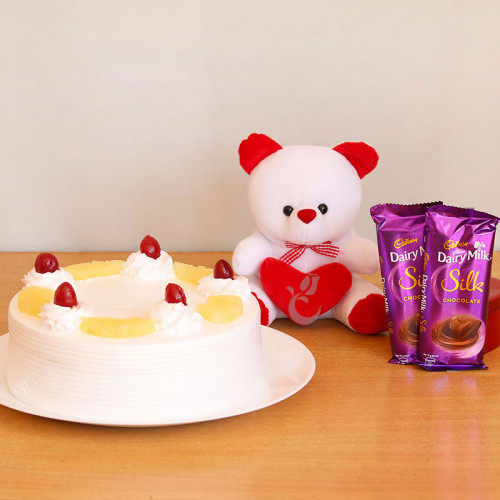 Combo Gift of 2 Dairy Milk Silk with Half  Kg Pineapple Cake and  Teddy