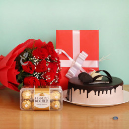 Poetic Love: A Gift Combo of 12 Red Roses, 0.5 Kg Chocolate Cake, 16 Ferrero Rocher and 1 Greeting Card Poetic Love: A Gift Combo of 12 Red Roses, 0.5 Kg Chocolate Cake, 16 Ferrero Rocher and 1 Greeting Card