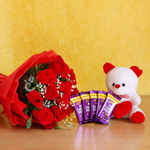 Gift Hamper of 10 red roses bouquet with Cadbury dairy milk and  teddy 